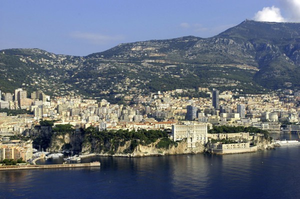 MONACO, Cote d Azur, Monte Carlo, Aerial view from the sea toward the coastal city and hills beyond