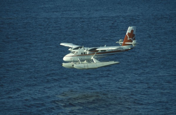 CANADA, British Colombia, Vancouver, Sea plane in Vancouver harbour used as link with isolated