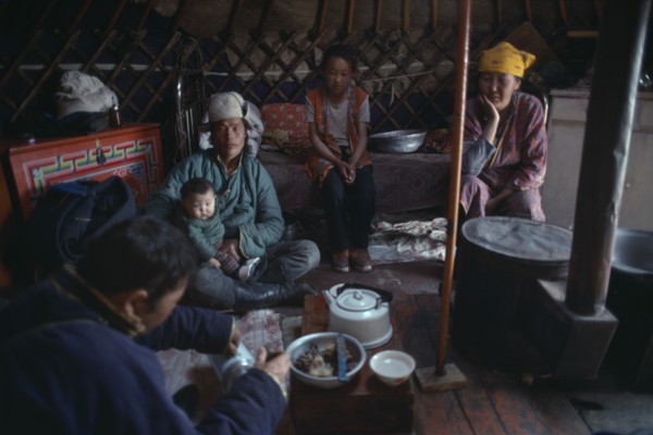 MONGOLIA, People, Mongolian family having meal inside a yurt