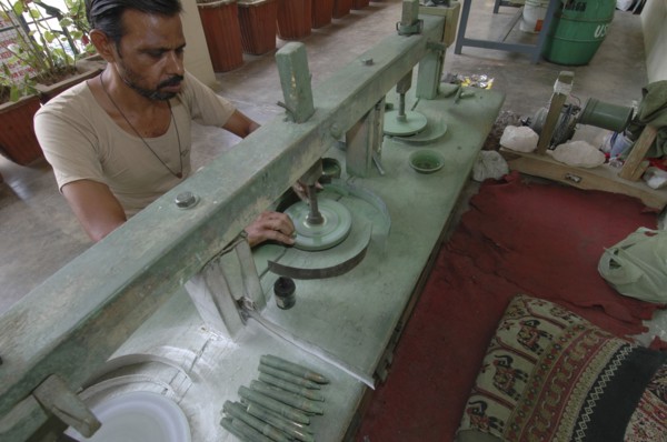 INDIA, Rajasthan, Jaipur, Man polishing precious stones