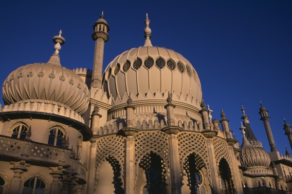 ENGLAND, East Sussex, Brighton, Brighton Pavilion exterior section showing onion domes in evening