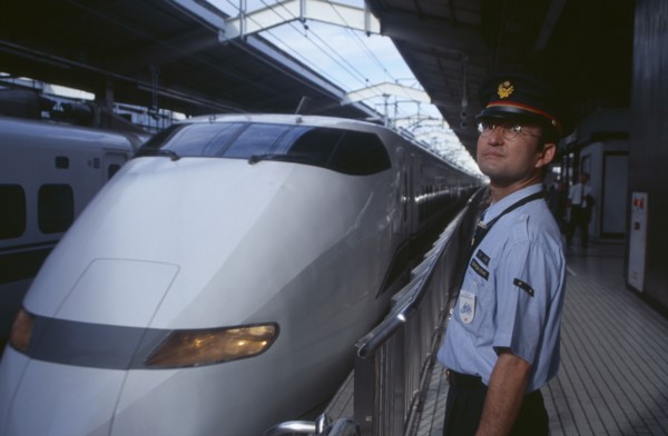 JAPAN, Honshu, Kyoto, Bullet train aka Shinkansen pulling into the station platform with train
