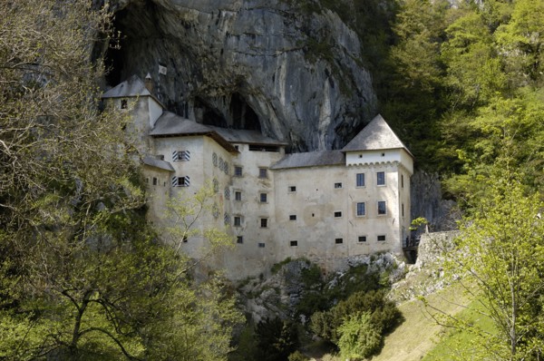 SLOVENIA, Predjama Castle, 16th Century castle built half way up 123M high cliff