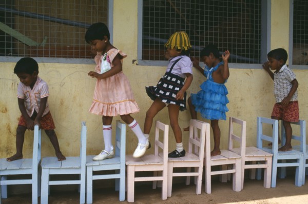 SRI LANKA, Colombo, Children learing to count through game playing.