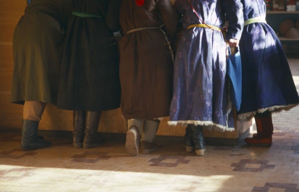 MONGOLIA, People, Cropped view of group of women standing at counter of shop.