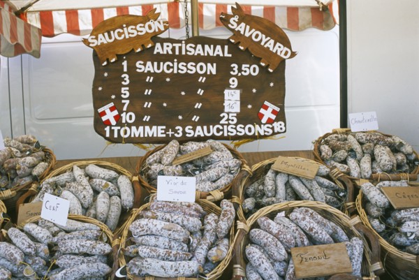 FRANCE, Rhone Alps, Haute Savoie, Samoens.  Baskets of different flavoured pork sausages for sale