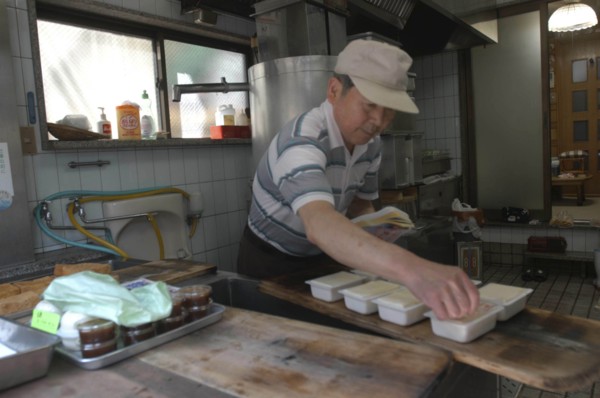 JAPAN, Honshu, Tokyo, "Yanak. Mr. Kyuhei Fukushima, 68 years old, at work in his tofu shop"