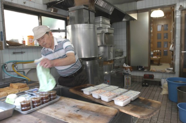 JAPAN, Honshu, Tokyo, "Yanak. Mr. Kyuhei Fukushima, 68 years old, at work in his tofu shop"