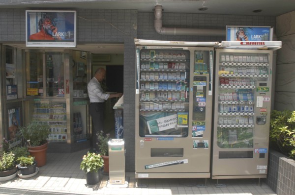 JAPAN, Honshu, Tokyo, Nezu. Cigarette shop with cigarette vending machines