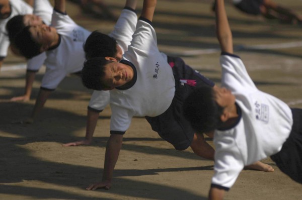 JAPAN, Chiba, Tako, Tako Elemetary School Undoukai or Sports Day. 6th grade boys perform massed