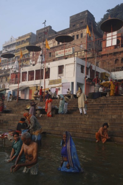 INDIA, Uttar Pradesh, Varanasi , Early morning bathers in the Ganges River by Dashaswamedh Ghat