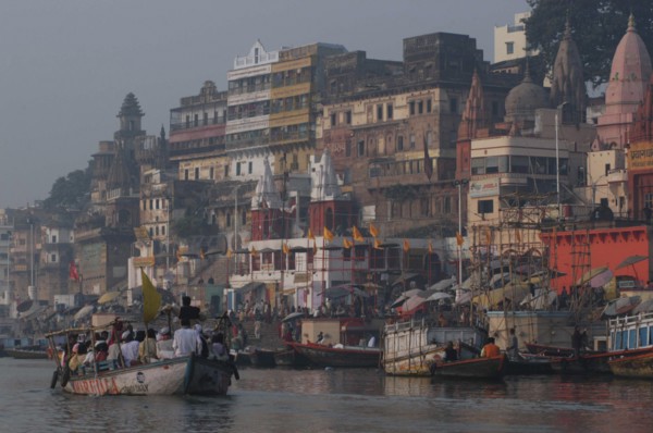 INDIA, Uttar Pradesh, Varanasi , Dashaswamedh Ghat on the Ganges River looking south with boats and