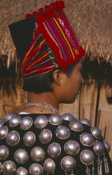 THAILAND, Chiang Mai Province, Muang Nga, Back view of a Jinghpaw woman in traditional jacket and