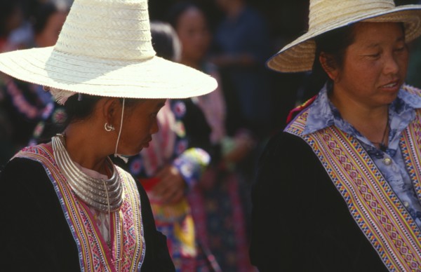 THAILAND, Chiang Mai, Two Hmong women in traditional attire