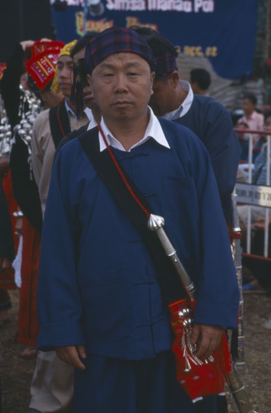 THAILAND, Chiang Mai Province, Samathi Mai, Kachin Manou. Kachin elder in line awaiting the start
