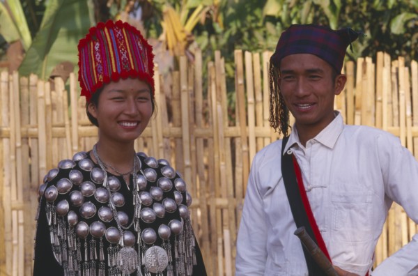 THAILAND, Chinag Mai Province, Muang Nga, Young Jinghpaw man and woman in traditional attire