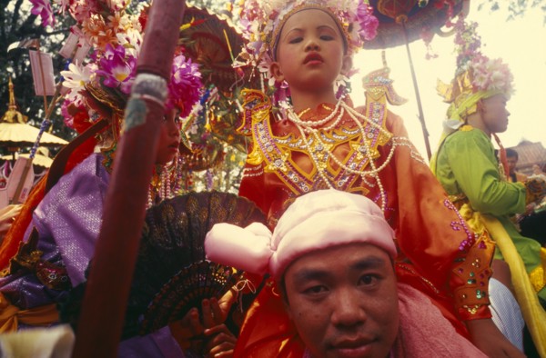 THAILAND, Chiang Mai, Shan Poi San Long. Crystal Children ceremony with Luk Kaeo in costume sitting