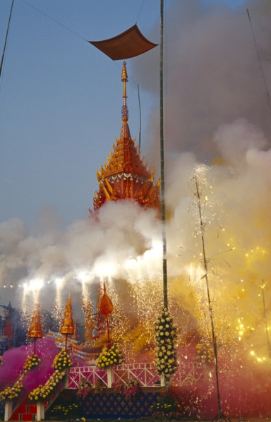 THAILAND, Chiang Mai, Revered monks funeral with smoking mythical elephant swan funeral pyre on the