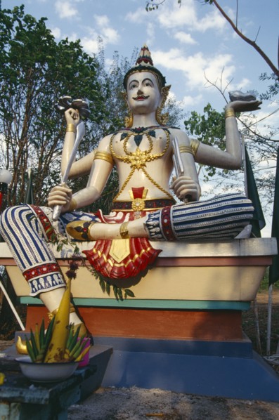 THAILAND, Chiang Mai, Wat Bahn Pueng Fang, Statue of Siva holding trident conch shell sword and