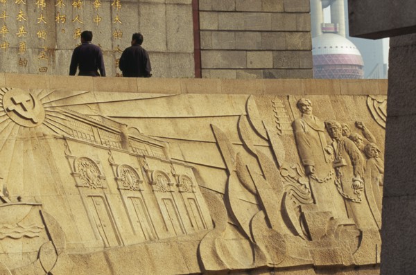 CHINA, Shanghai, The Martyr’s Monument.  Detail of relief carving with two men walking along top of
