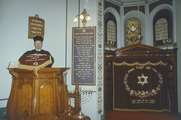 ENGLAND, Leicester, Interior of Leicester synagogue with Rabbi.