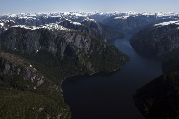 USA, Alaska, Misty Fjords Nat. Monument, Aerial view over river and surrounding rocky peaks