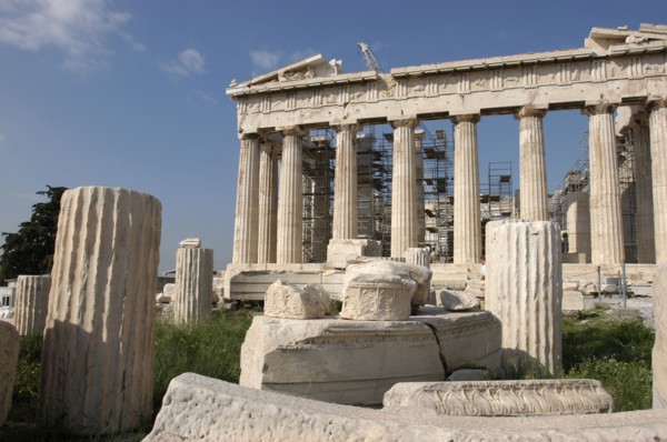GREECE, Athens, Acropolis. View of the ruined Parthenon with smaller sections of columns in the