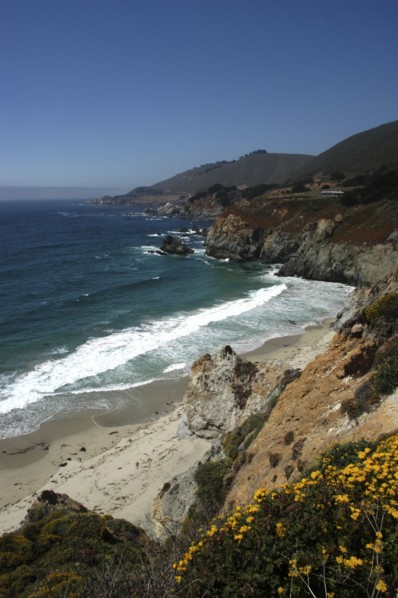 USA, California, Big Sur, Pacific Coast Highway. View over sandy bay and rocky coastline
