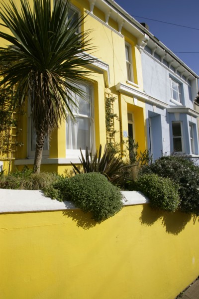 ENGLAND, East Sussex, Brighton, Brightly coloured terraced houses in Kemp Town