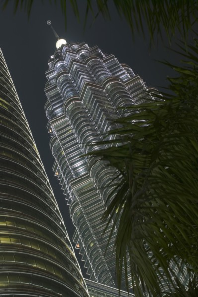 MALAYSIA, Kuala Lumpur, Angled view of the Petronas Towers illuminated at night