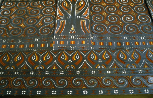 INDONESIA, Toraja, Detail of carving and painting in Toraja House.