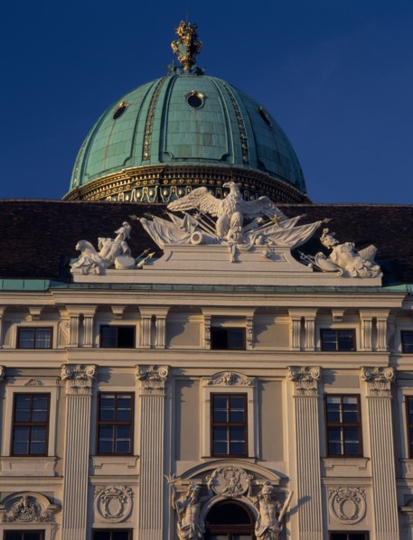 AUSTRIA, Vienna, Hofburg Royal Palace. St Michael Gate facade detail and green dome seen from In