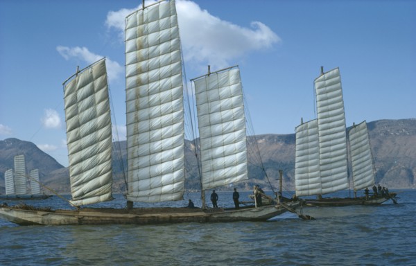 CHINA, Yunnan Province, Kunming Lake, Fishing boats in full sail.