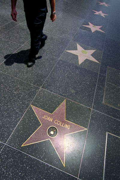 USA, California, Los Angeles, Hollywood. Pink marble and bronze stars embedded into Hollywood