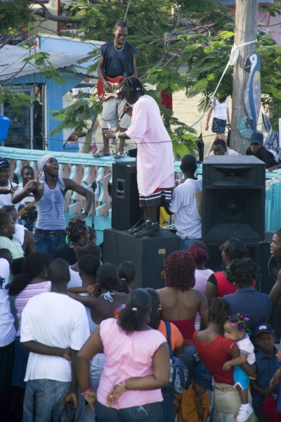 WEST INDIES, St Vincent & The Grenadines, Union Island, Singer and guitarist with sound system at