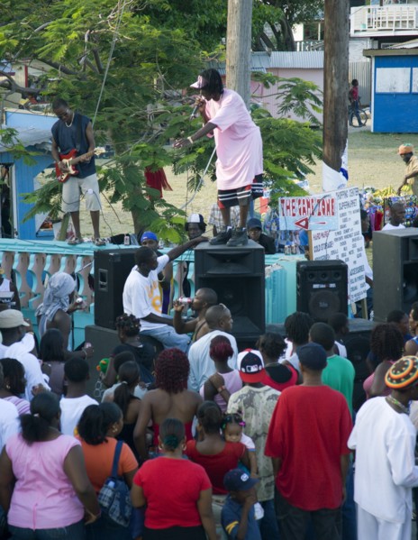 WEST INDIES, St Vincent & The Grenadines, Union Island, Singer and guitarist with sound system at