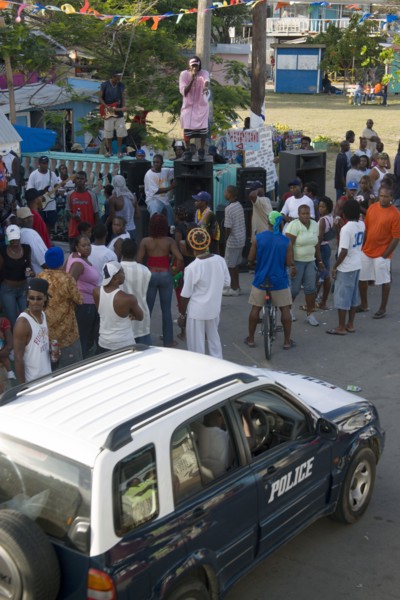 WEST INDIES, St Vincent & The Grenadines, Union Island, Singer singing to and about police at