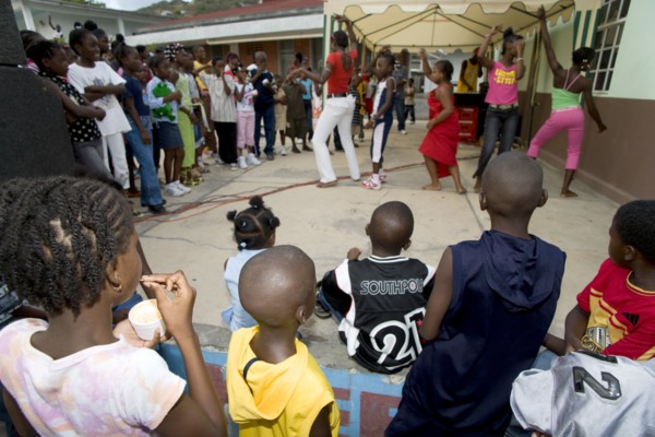 WEST INDIES, St Vincent & The Grenadines, Union Island, Children watching other children dancing to