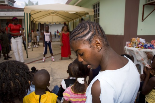 WEST INDIES, St Vincent & The Grenadines, Union Island, Children watching other children dancing to