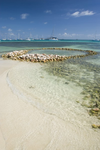 WEST INDIES, St Vincent & The Grenadines, Union Island, Conch shell structures on the beach at