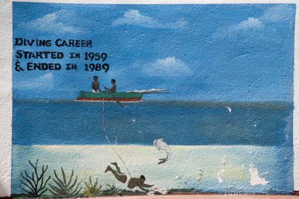 WEST INDIES, St Vincent & The Grenadines, Union Island, Wall painting in Clifton depicting the