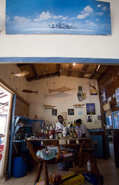 WEST INDIES, St Vincent & The Grenadines, Bequia, Bar and staff at beachside restaurant on Lower