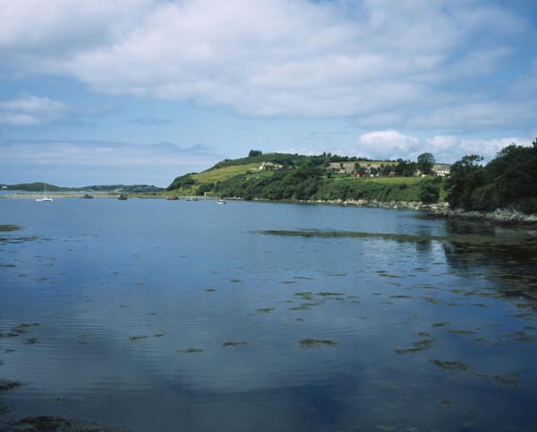 IRELAND, County Kerry, Ring of Kerry, Beara Peninsula. View over water towards boats and houses on