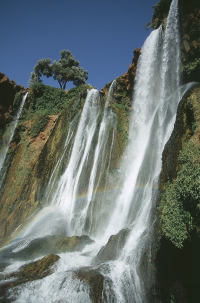 MOROCCO, Middle Atlas, Cascades d’Ouzoud, Waterfalls of the Olives.  Multiple falls cascading over