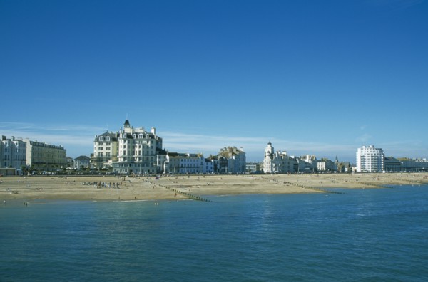 ENGLAND, East Sussex, Eastbourne, View across sea towards beachfront.