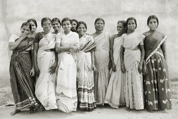INDIA, Tamil Nadu, Vellamadam, Female workers at St. Joseph's Orphanage smile and laugh for the