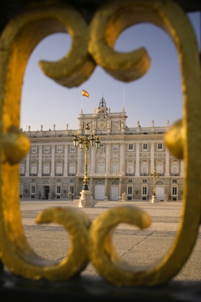 SPAIN, Madrid, The Palacio Real. The Royal Palace seen through a section of the main gates.