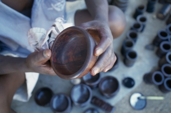 MALAWI, Zalewa, Kadzuwa Crafts.  Cropped view of craftsman producing fair trade carved items for