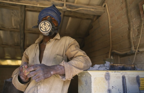 MALAWI, Dedza, Dedza Potteries producing Fair Trade goods for export.  Craftsman wearing protective