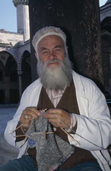 TURKEY, Istanbul, Hat vendor outside the Blue Mosque